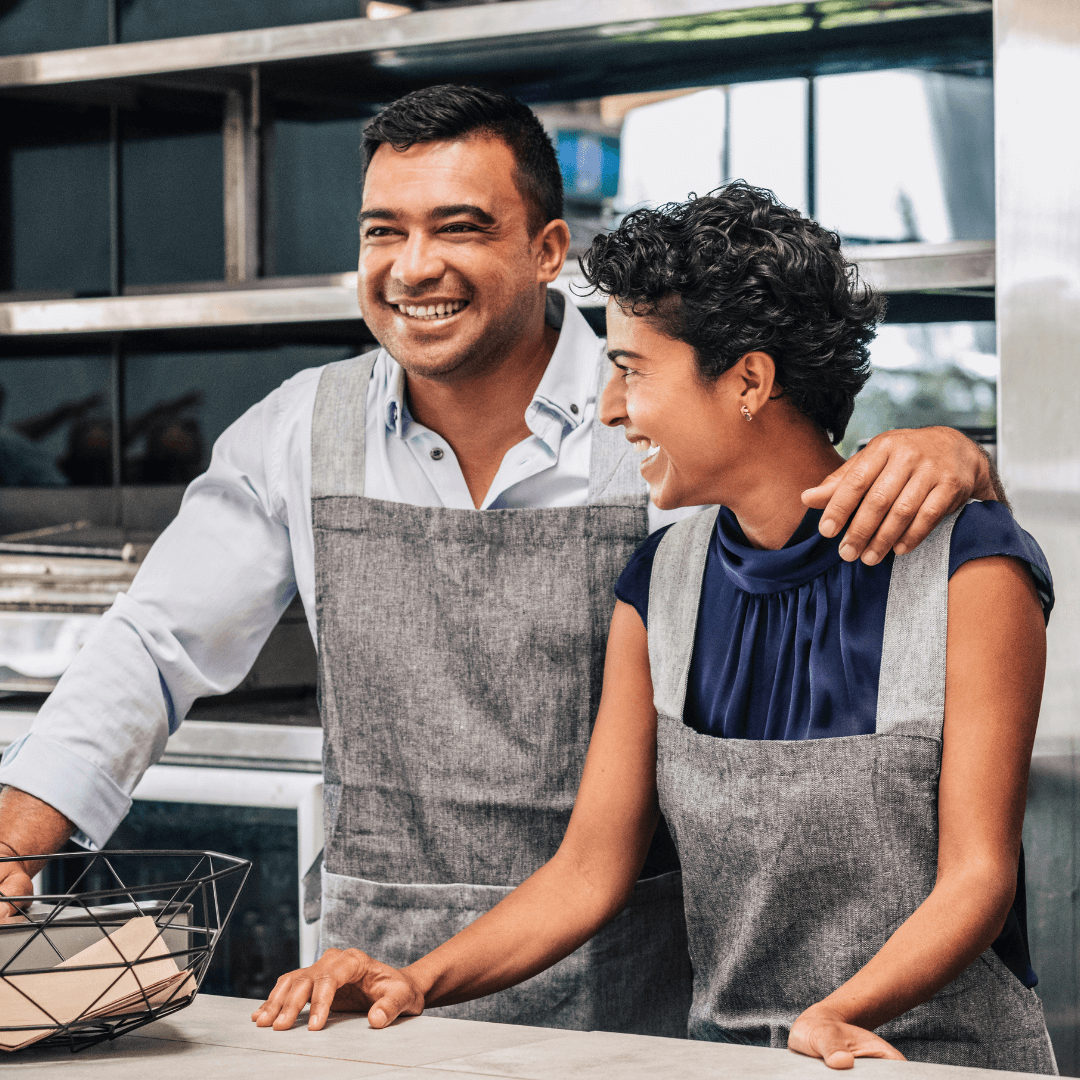 Happy couple, owners of a small business in South West WA, benefiting from Hebden Legal's expertise in business asset protection and commercial agreements.